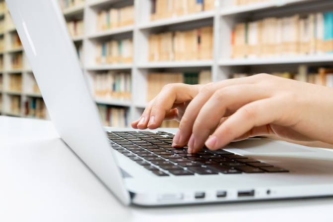 Library Computer and Bookshelf